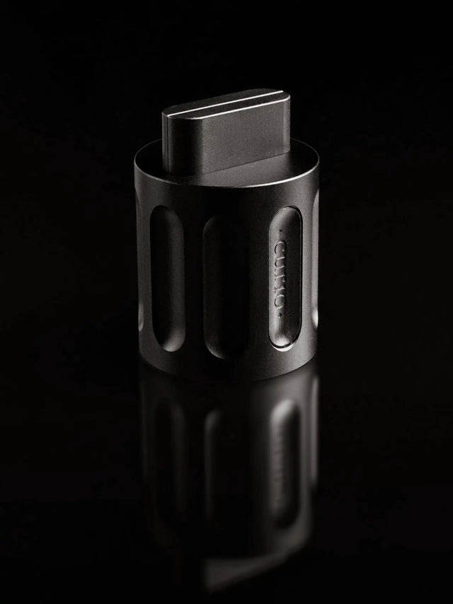 A black Curio Column Puzzle disassembled with the shuttle sticking out of the column on a black background