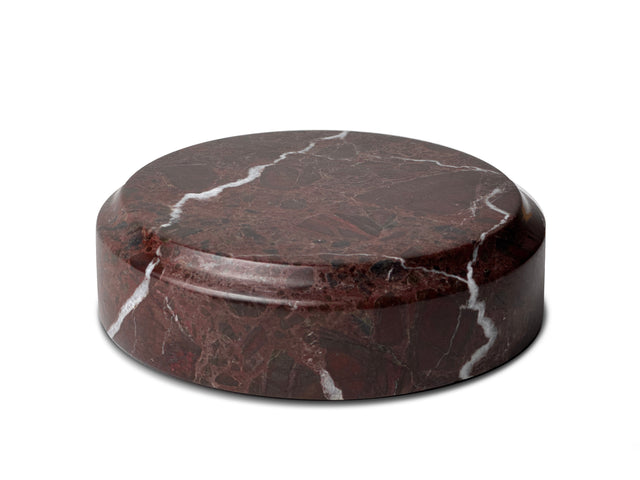 The Curio Plinth marble display stand in Roso Lepanto red on a white background