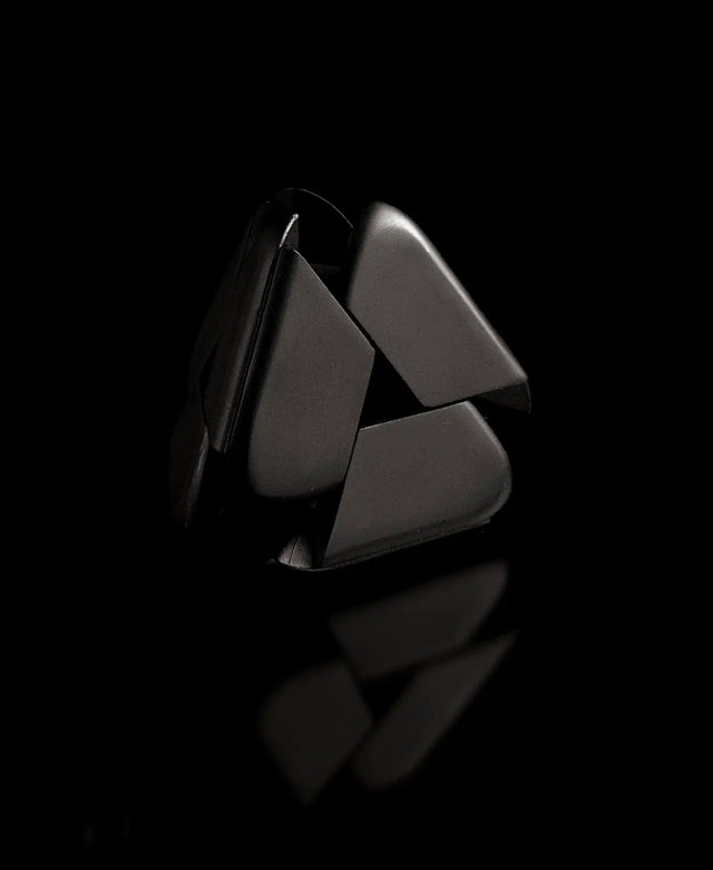 A black Craighill Tetra Puzzle Halfway Assembled on a Black background