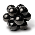 The black Curio Atom Puzzle assembled on a white background