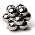 The silver Curio Atom Puzzle assembled on a white background