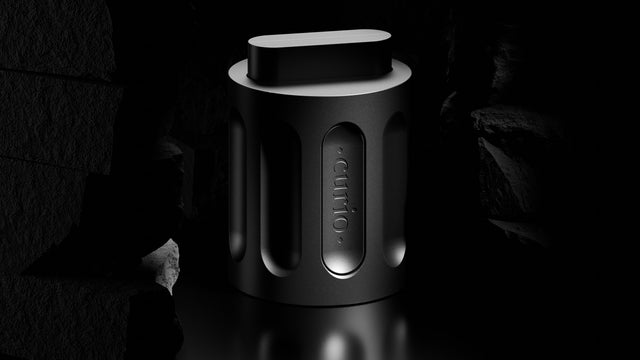 A 3D render of a disassembled Curio Column Puzzle with the shuttle extended, set in a dramatically lit stone architectural environment