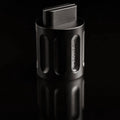A black Curio Column Puzzle disassembled with the shuttle sticking out of the column on a black background