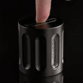 An index finger attempts to assemble a Curio Column Puzzle on a black background