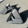 The black Craighill Tetra Puzzle in its foam packaging insert