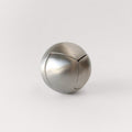 The stainless steel Craighill Venn Puzzle fully assembled on a gray background