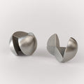 Craighill Venn Puzzle designed by Revision in Steel Disassembled on Gray background